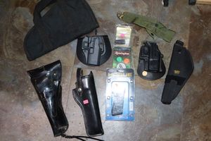lot 43 image: Gun holsters and Misc. firearm items