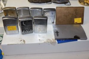 lot 103 image: Metal credit card holders and Vintage lighters and parts (some need repair)