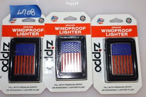 lot 108 image: Three flag Zippo lighters (unopened)