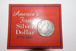 lot 135 image: Americas first silver dollar replica coin (pewter)