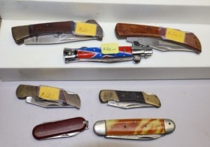 lot 203 image: Pocket knives as shown