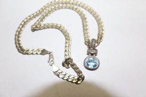 lot 211 image: Jewelry Silver necklace with light blue stone pendant