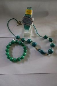 lot 332 image: Green jewelry as shown