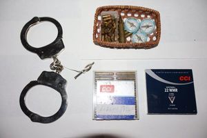 lot 350 image: Ammo cartridges and handcuffs