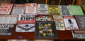 lot 455 image: Metal signs and two 2024 calendars