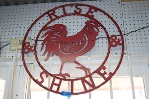 lot 431 image: Metal sign Rise and Shine red