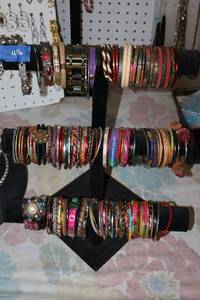 lot 416 image: Jewelry bracelet stand with colorful bracelets