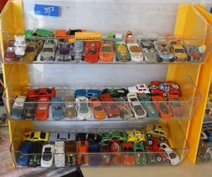 lot 357 image: Toy cars with display unit. Includes cars from England.