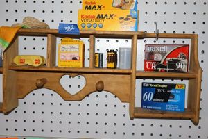 lot 382 image: Vintage film rolls, blank cassette tapes, with decorative shelf