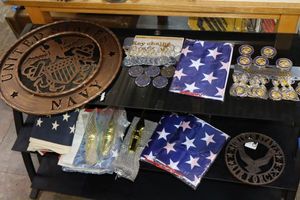 lot 474 image: US Navy and Air Force metal signs, plus magnets, keychains and flags