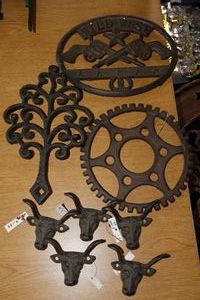 lot 476 image: Cast iron decorations trivets and coat hooks