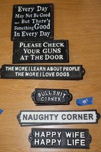 lot 484 image: Cast iron sign decorations