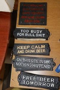 lot 485 image: Cast iron sign decorations