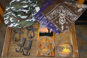 lot 477 image: Camo hat, bandanas, and Cast iron decorations coat hooks and horseshoe