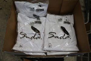 lot 521 image: Unopened white shirts and thermal wear
