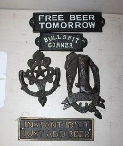 lot 543 image: Cast iron signs and decor