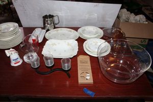 lot 553 image: Limoges dishes (some have chips), Texas bell, Measuring cup, candle holder, and more