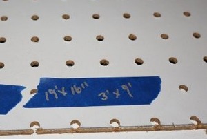 lot 611 image: Peg boards, 19 ft. by 16, one section approx. 3x9 (over door and end piece) - must bring tools to remove late Sat. or Sunday