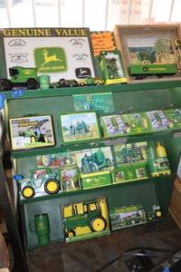 lot 437 image: Green metal display stand only with wheels ( not contents)