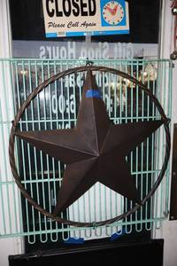 lot 621 image: Metal circle star sign