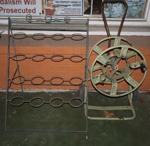lot 622 image: Garden hose reel and metal display flower stand