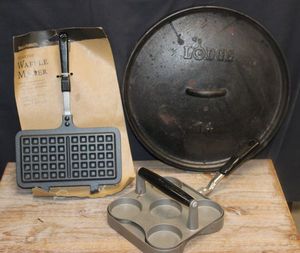lot 97 image: Cast iron cookware, waffle maker, sliders and cast iron lid