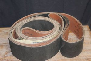 lot 100 image: Large Quantity of belt sandpaper see photos for more details