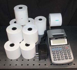 lot 109 image: Canon p1-dhv 12-digit palm printing calculator and extra rolls of printer paper