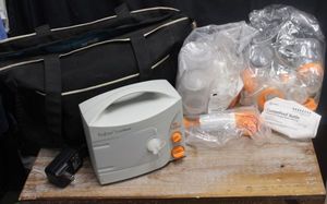 lot 152 image: Breast pump and accessories, appears unused