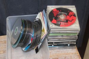 lot 180 image: Quantity of Loose CDs and DVDs