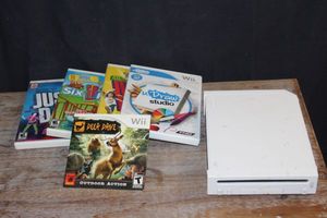 lot 197 image: Wii, no cords or controllers, and Wii Games as Shown