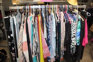 lot 31 image: Entire Rack of Womens Clothing, Variety of styles and sizes see photos for more details (rack not included)