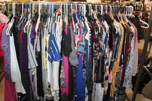 lot 32 image: Entire Rack of Womens Clothing, Variety of styles and sizes see photos for more details (rack not included).