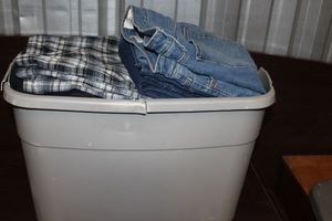 lot 39 image: Mens clothing, variety of styles, and sizes (tote not included)