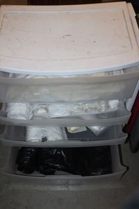 lot 42 image: Plastic drawer set with co tents of trash bags, various sizes