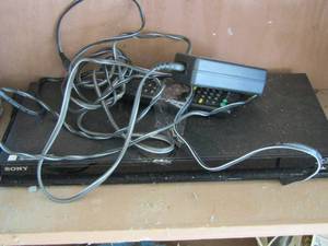 lot 36 image: sony dvd player with cords and remote
