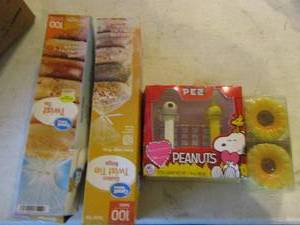 lot 199 image: peanuts Pez candies, sunflower salt and pepper shakers, twist tie bags
