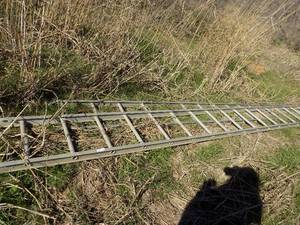lot 547 image: 36 ft. extension ladder pieces are not attached