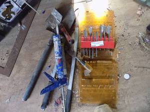 lot 630 image: set of very nice drill bits, caulking gun, tree trimmers and shovel