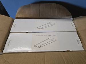 lot 133 image: 7 Boxes of 16 Xenon Undercabinet Lights.  8 Lights Per Box