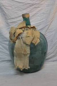 lot 18 image: vintage green glass large bottle