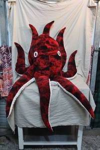 lot 19 image: large, realistic red octopus stuffed animal,