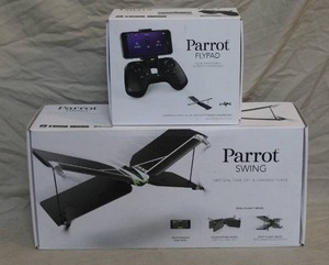 lot 31 image: Parrot Swing mini-drone with a Flypad controller. The Parrot Swing is a unique vertical take-off and landing (VTOL) drone that can fly like both a quadcopter and a plane