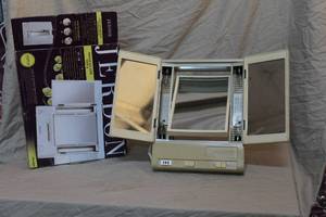 lot 32 image: Jerdon Tri-Fold Two-Sided Lighted Makeup Mirror,