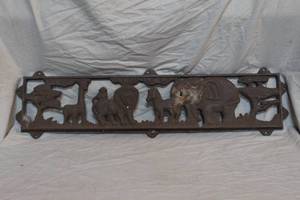 lot 53 image: This is a cast-iron panel with an African safari or jungle animal motif.