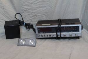 lot 62 image: 2- alarm clocks and vintage analog thermometer and humidity indicator.