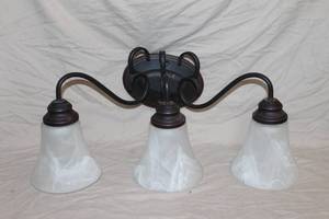 lot 72 image: Lalia Home Essentix 3-Light Wall Mounted Curved Vanity Light.