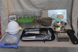 lot 73 image: Mixed kitchen lot glass cutting board metal ice cream scoop egg holder with lid Microwave Egg Cooker shredder and much more see pictures for details