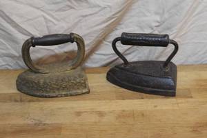lot 140 image: 2- vintage cast iron also known as a flat iron or smoothing iron