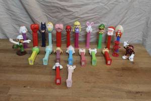 lot 165 image: collection of various PEZ candy dispensers and a few others like Luigi and a California Raisins figurine,